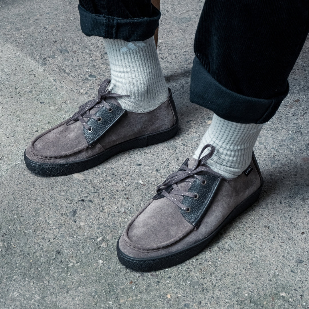 OSWEN Konrad Low shoes in Taupe suede and leather worn with casual trousers.